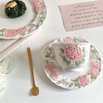 Afternoon tea cups with a pink rose coffee cup mug